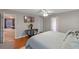 Main bedroom featuring hardwood floors, a ceiling fan, and a TV at 10435 Eastpark Lake Dr, Orlando, FL 32832