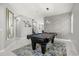Spacious game room featuring a pool table, modern lighting, and stylish decor at 1109 Castlevecchio Loop, Orlando, FL 32825