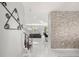 Modern hallway with contemporary decor, leading to an open-concept living area and kitchen at 1109 Castlevecchio Loop, Orlando, FL 32825