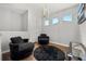 Cozy loft with plush seating, modern lighting, and hardwood floors at 1109 Castlevecchio Loop, Orlando, FL 32825