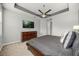 Spacious main bedroom with tray ceiling, TV, and dresser featuring a plush bed with decorative pillows at 1109 Castlevecchio Loop, Orlando, FL 32825