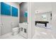 Beautiful powder room with a blue art, a modern vessel sink, and elegant wallpaper at 1109 Castlevecchio Loop, Orlando, FL 32825