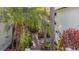 Serene courtyard with lush tropical landscaping, providing a private outdoor retreat at 1117 Damask St, Celebration, FL 34747
