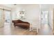Bright hallway showcasing hardwood floors, a seating area, and an opening into the kitchen at 1117 Damask St, Celebration, FL 34747