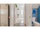 Inviting hallway leads to bathroom and front door, enhancing the home's welcoming ambiance at 1117 Damask St, Celebration, FL 34747