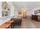 Open-concept living room with hardwood floors, traditional decor, and a view of the kitchen at 1117 Damask St, Celebration, FL 34747