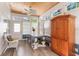 Bright sunroom with a wooden ceiling, a large table, and lots of natural light at 1117 Damask St, Celebration, FL 34747