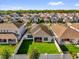 An aerial view shows a well-maintained backyard and landscaping in a suburban neighborhood at 1210 Pando Loop, Orlando, FL 32824