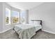 Comfortable bedroom featuring a large bay window and a cozy bed with stylish bedding at 1210 Pando Loop, Orlando, FL 32824