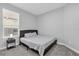 Simply decorated bedroom with a cozy bed and a convenient nightstand at 1210 Pando Loop, Orlando, FL 32824