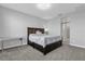 Comfortable bedroom with a large dark wood bed and carpet flooring at 1210 Pando Loop, Orlando, FL 32824