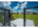 A fenced community dog park featuring a waste station and ample green space for pets to play at 1210 Pando Loop, Orlando, FL 32824
