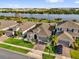 Beautiful single-Gathering home featuring a well-manicured lawn and stunning lake view at 1210 Pando Loop, Orlando, FL 32824
