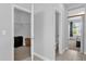 Hallway view showcasing an open closet, toilet, and view to the bedroom at 1210 Pando Loop, Orlando, FL 32824