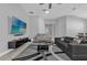 Spacious open living room with modern furniture and a ceiling fan at 1210 Pando Loop, Orlando, FL 32824
