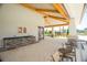 Outdoor kitchen and entertainment area featuring a stone countertop, sink, and ample seating at 1210 Pando Loop, Orlando, FL 32824