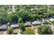 A high angle aerial view reveals the home in a neighborhood near mature Florida trees at 132 W Lauren Ct, Casselberry, FL 32730