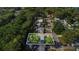 Aerial view of property with boundary lines in a tree-filled residential area at 132 W Lauren Ct, Casselberry, FL 32730