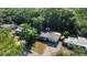 Aerial view of the property nestled in a quiet neighborhood with mature trees at 132 W Lauren Ct, Casselberry, FL 32730