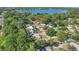 Scenic aerial view of a neighborhood, homes, and a beautiful lake surrounded by lush trees at 132 W Lauren Ct, Casselberry, FL 32730