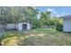 The large backyard includes plenty of room for outdoor activities and storage at 132 W Lauren Ct, Casselberry, FL 32730