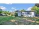 The backyard includes lush greenery, offering space for relaxation and recreation at 132 W Lauren Ct, Casselberry, FL 32730