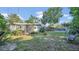 Expansive backyard featuring mature trees, and a patio perfect for outdoor entertaining at 132 W Lauren Ct, Casselberry, FL 32730