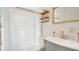 Clean bathroom with updated vanity, storage shelves, and neutral decor for a refreshing feel at 132 W Lauren Ct, Casselberry, FL 32730
