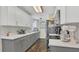 Modern kitchen featuring white cabinetry, updated appliances, and sleek countertops at 132 W Lauren Ct, Casselberry, FL 32730