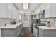 Contemporary kitchen with bright countertops, modern appliances and streamlined design at 132 W Lauren Ct, Casselberry, FL 32730