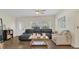 Inviting living space with dark floors, comfortable seating, and a bright, airy ambiance at 132 W Lauren Ct, Casselberry, FL 32730