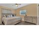 Comfortable bedroom with hardwood floors and natural light provides a peaceful retreat at 132 W Lauren Ct, Casselberry, FL 32730