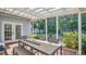 Back patio with table and chairs provides great outdoor entertaining space and access to backyard at 132 W Lauren Ct, Casselberry, FL 32730
