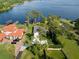 Stunning aerial view of the home, boat dock, and expansive lakefront property at 1322 Palm Dr, Apopka, FL 32703