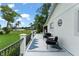 Backyard deck with black wrought iron railing and view of the waterfront at 1322 Palm Dr, Apopka, FL 32703