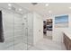 Spacious bathroom featuring a marble shower with glass door and walk-in closet at 1322 Palm Dr, Apopka, FL 32703
