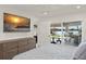Bedroom featuring a large glass sliding door with backyard and waterfront views at 1322 Palm Dr, Apopka, FL 32703