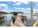 Private boat dock with boat lifts, offering convenient access to the serene lake waters at 1322 Palm Dr, Apopka, FL 32703