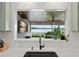 Kitchen with marble countertops overlooking the patio and waterway at 1322 Palm Dr, Apopka, FL 32703