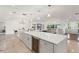 Spacious open-concept design with a large kitchen island connecting to the living area at 1322 Palm Dr, Apopka, FL 32703