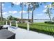 Picturesque lake view from the patio featuring a private dock and boat lift on a sunny day at 1322 Palm Dr, Apopka, FL 32703