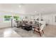 Comfortable living room with ample seating, bright natural light, and neutral decor at 1322 Palm Dr, Apopka, FL 32703