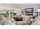 A cozy living room boasts a sleek fireplace and a modern entertainment center at 1322 Palm Dr, Apopka, FL 32703
