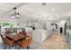 Bright open-concept living space with kitchen island, dining area, and comfortable lounge at 1322 Palm Dr, Apopka, FL 32703