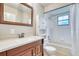 Bathroom features a vanity, tile flooring, and a shower-tub combination at 13245 Shore Dr, Winter Garden, FL 34787