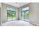 Bright dining room featuring large windows and light wood floors, perfect for enjoying natural light and views at 13245 Shore Dr, Winter Garden, FL 34787