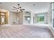 Spacious living room featuring an open layout, carpet, and lots of natural light at 13245 Shore Dr, Winter Garden, FL 34787