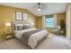 Bedroom with vaulted ceiling, neutral decor, and a comfortable bed complemented by stylish wall art at 13245 Shore Dr, Winter Garden, FL 34787