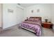 Serene bedroom with soft lighting, carpeted floors, and simple wall decor at 14001 Jomatt Loop, Winter Garden, FL 34787
