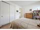 Comfortable bedroom showcasing a plush bed and a double door closet at 14001 Jomatt Loop, Winter Garden, FL 34787